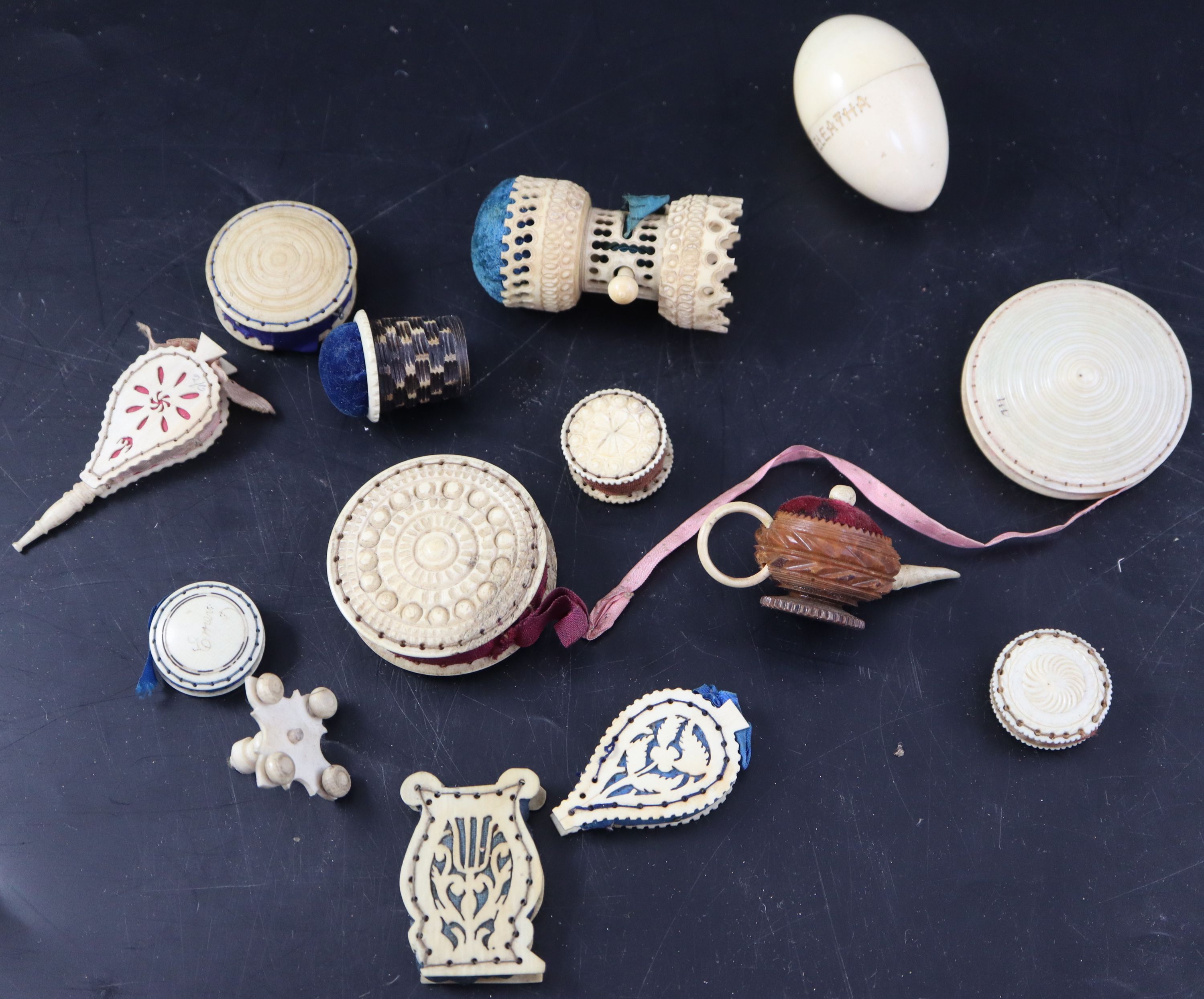 A collection of twelve assorted 19th century ivory pin cushions